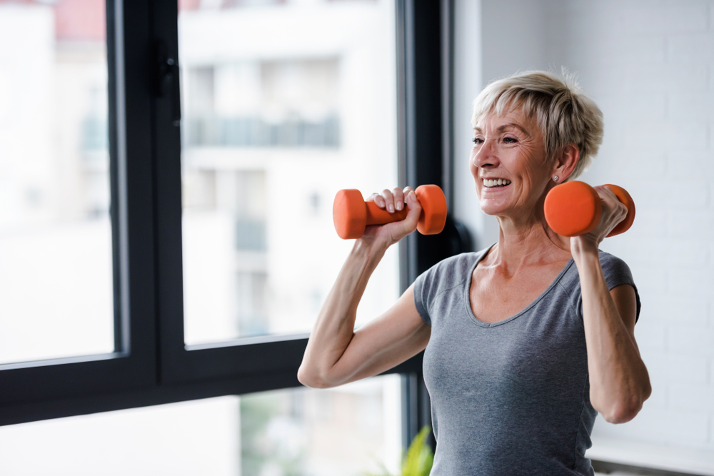 woman doing strength training with dumbbells