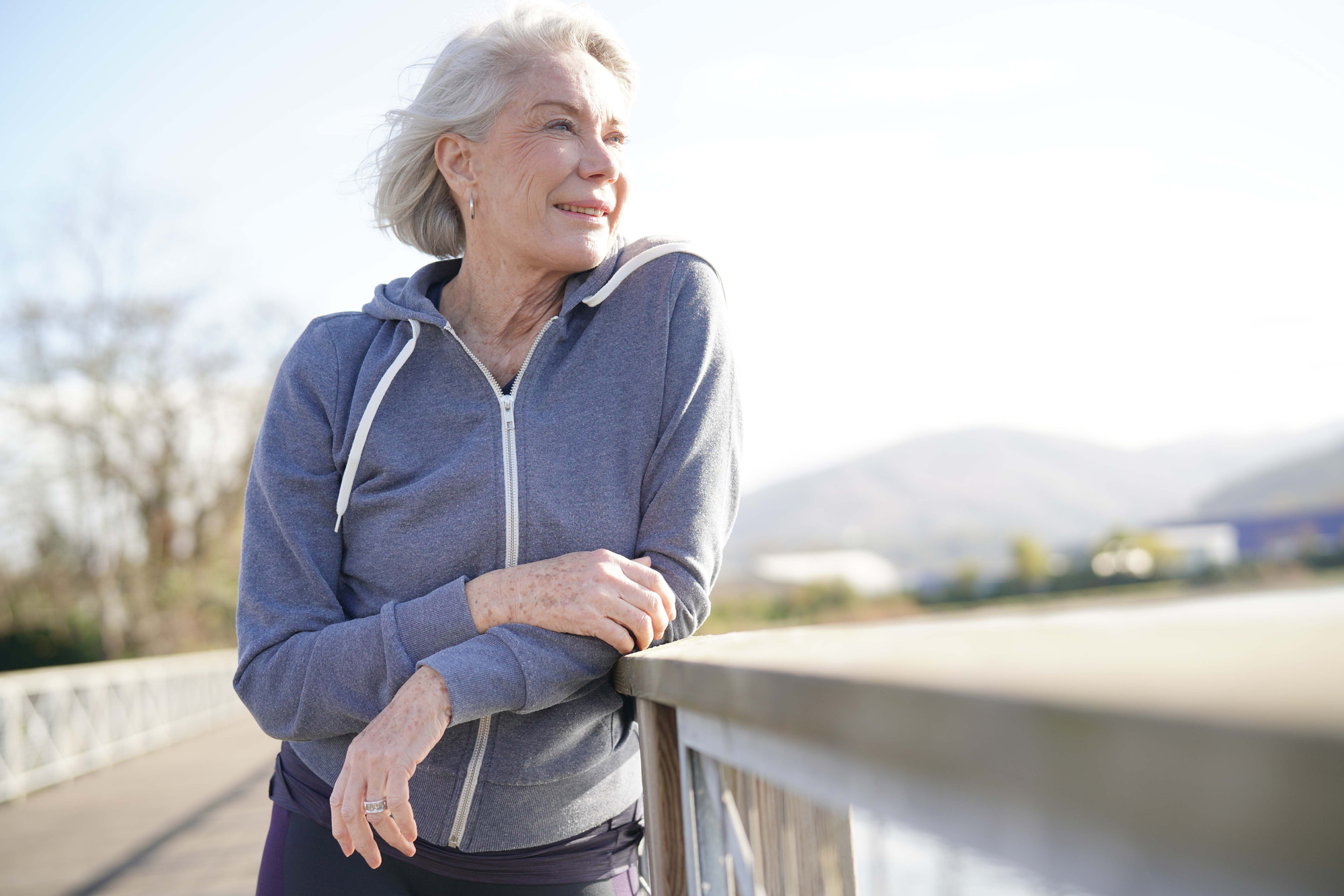 Senior woman wearing sportswear outdoors.