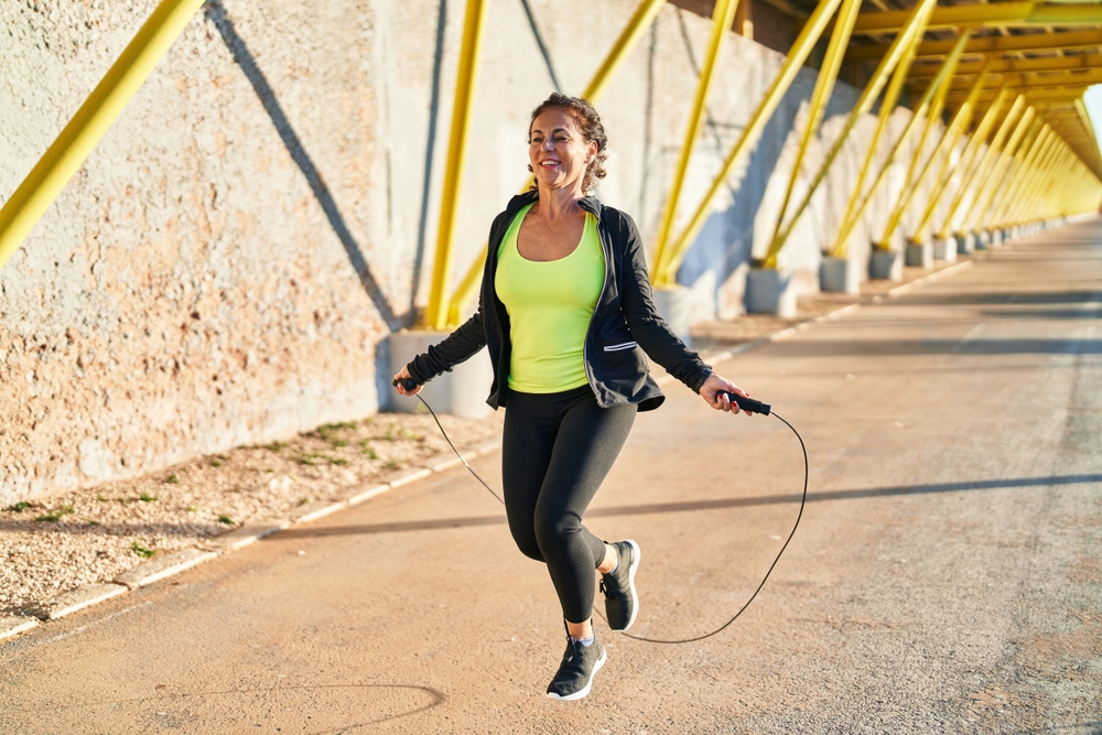 woman jump roping outside