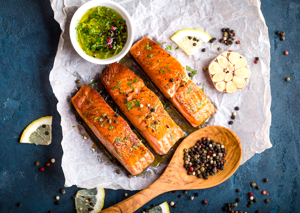 Top view of salmon filets on a concrete background.