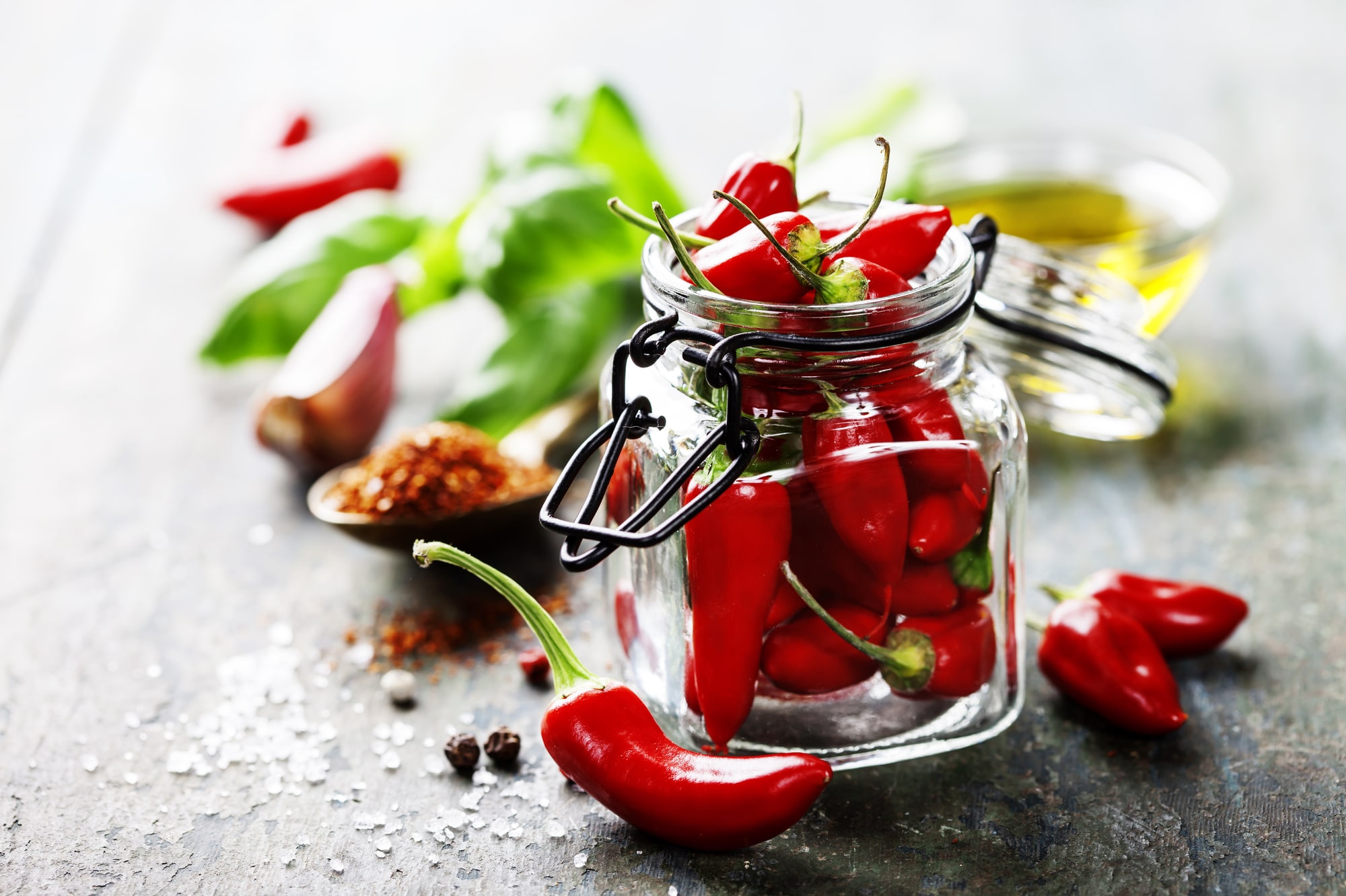 Red chili peppers in a glass jar.