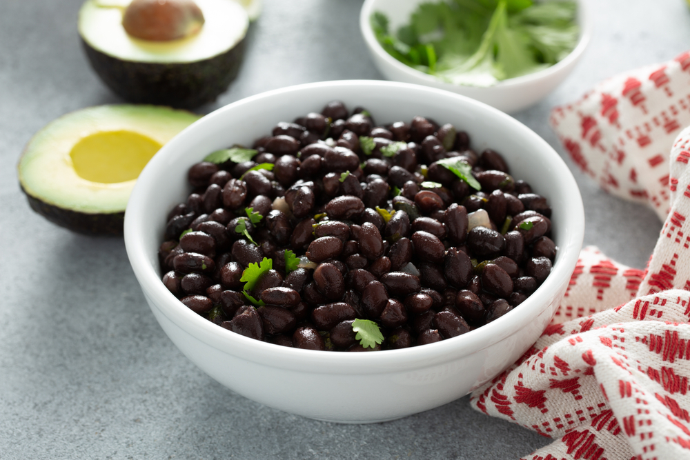 Close up of a bowl of black beans.