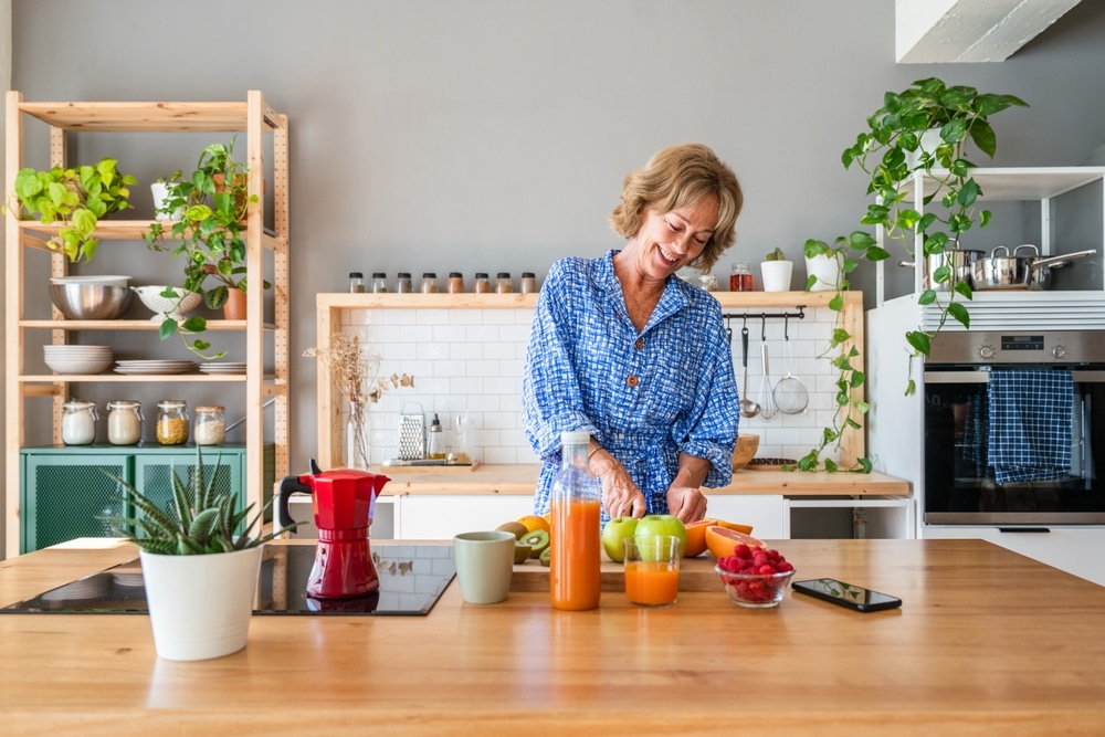 Older woman cooking in her kitchen.