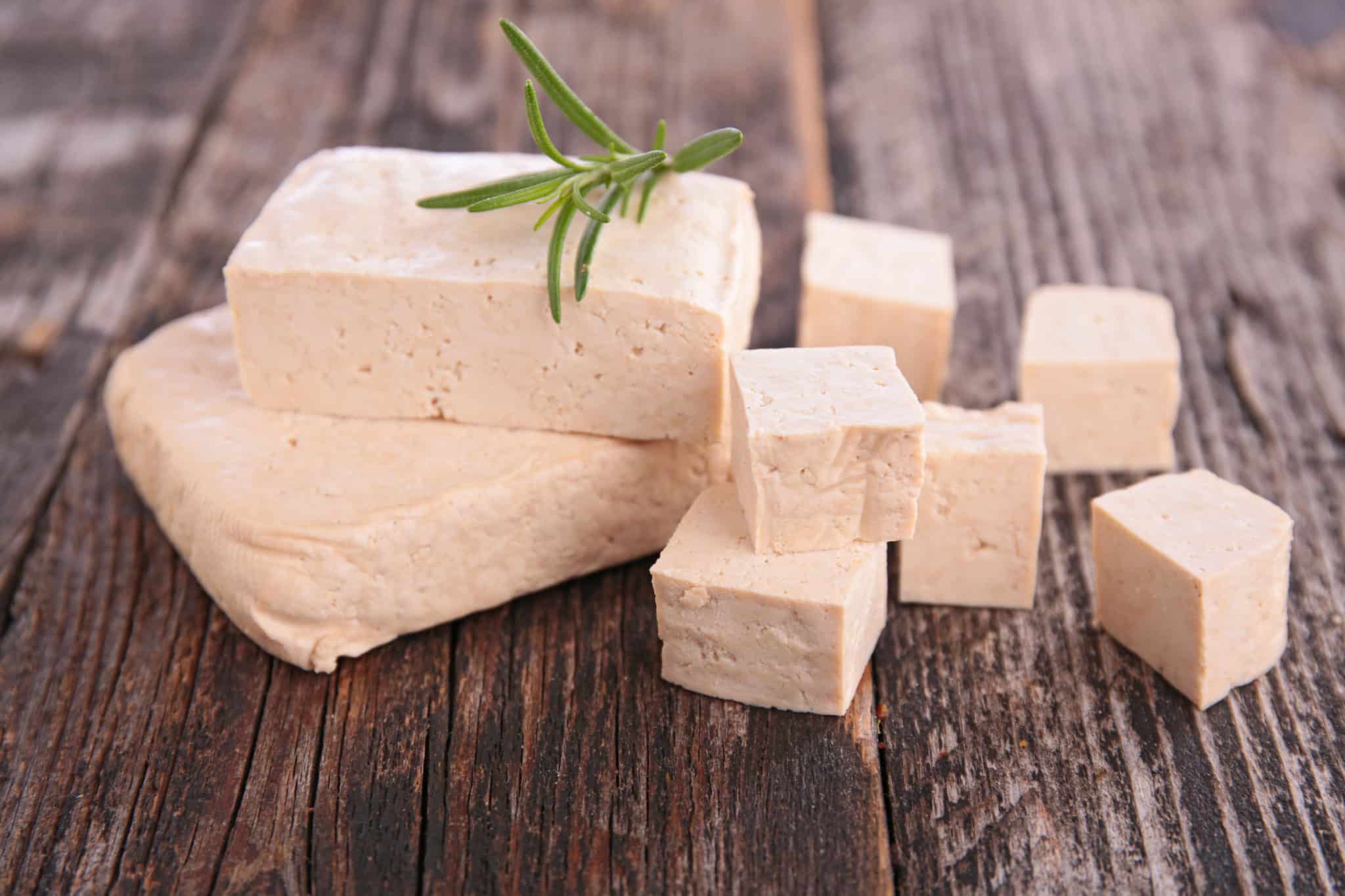 A block of tofu cut into cubes.