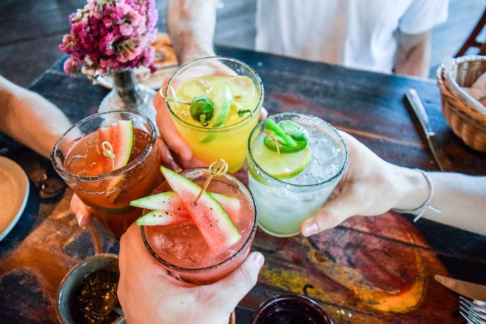 Friends toasting with cocktails.