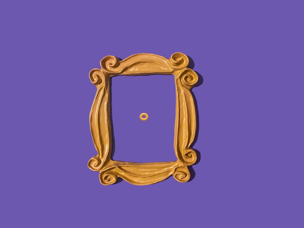 Yellow frame from the Friends tv show which was used around Monica's peephole on a purple door.