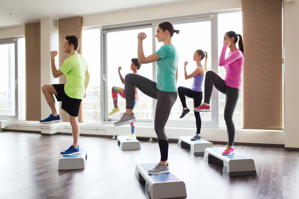 A group fitness class use step platforms.