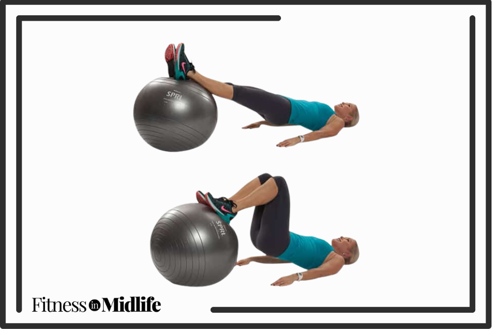 Chris Freytag doing a stability hamstring roll in exercise using a workout ball.