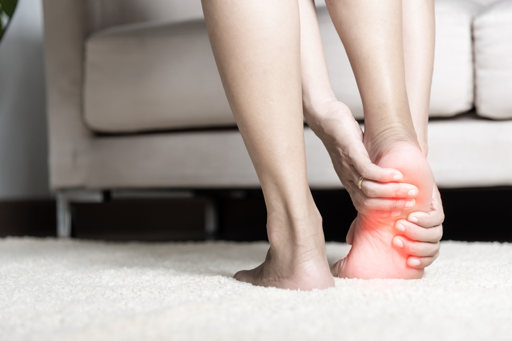 woman with heel pain in foot