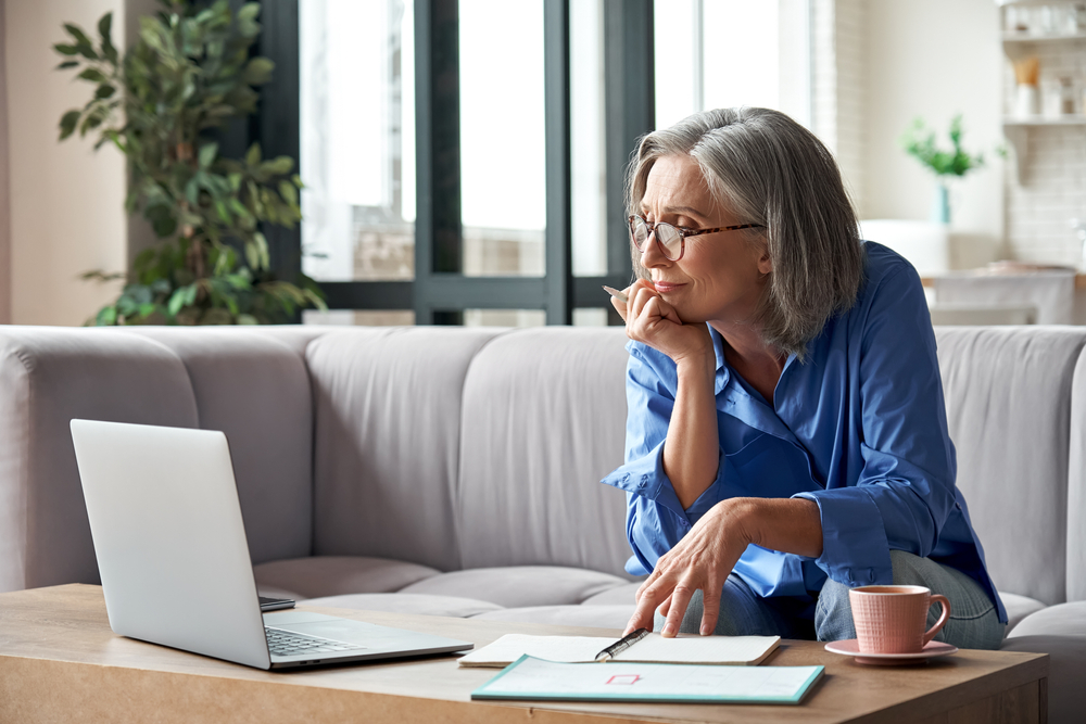 woman working on computer in living room