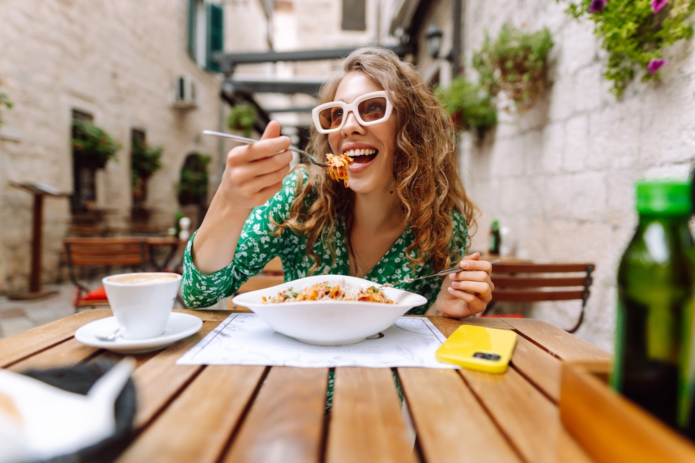 woman eating healthy at restaurant