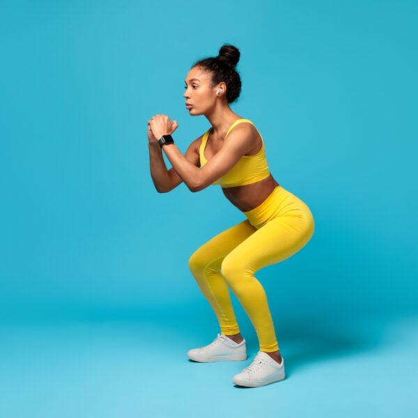 woman doing expert squat exercise for stronger legs