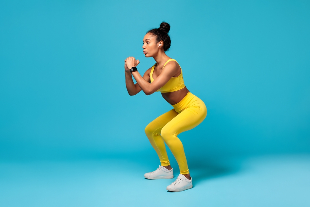 woman doing expert squat exercise for stronger legs